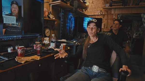 Starla and Seth Collins watch their neighbor Josh Alspaw’s TikTok about their feud over a gate near their homes in rural Montana.