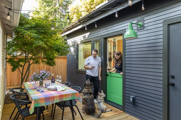John and Ciera, with their dogs Stanley and Rosie, moved into their Seattle home in 2020. They converted an existing shed into a 180-square-foot flex space when they needed more square footage.  The wood deck is by Kebony, and the CB2 chairs surround a table from Webstaurant Store.