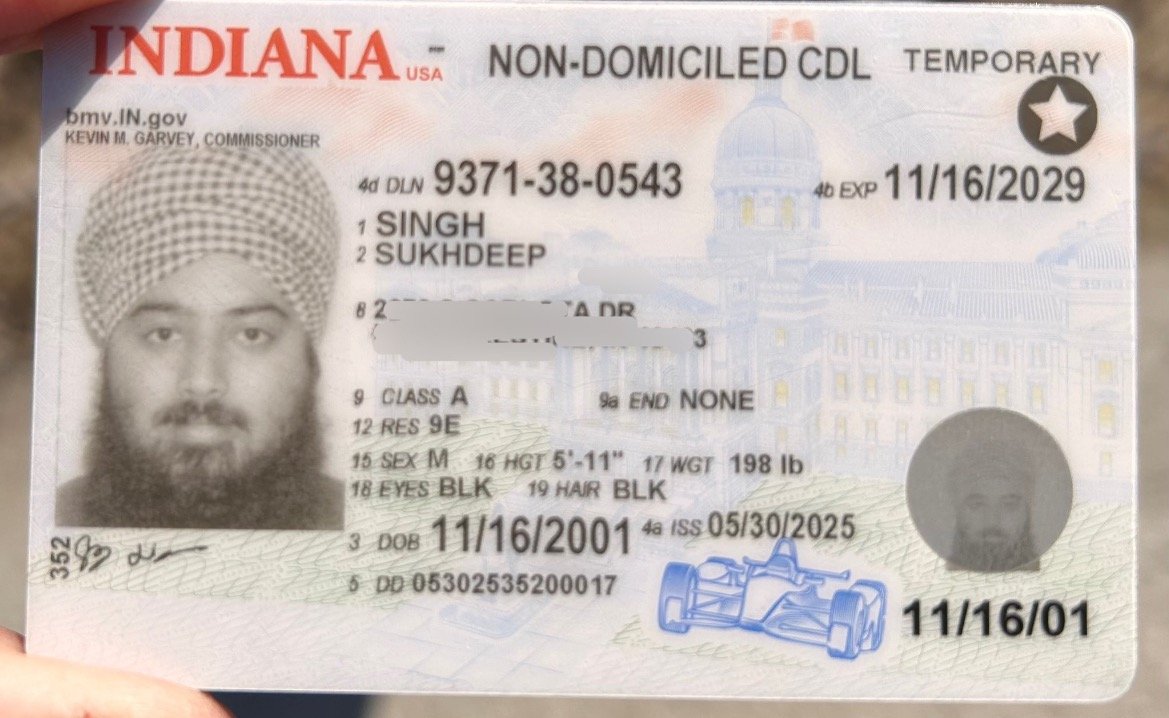 Temporary Indiana non-domiciled commercial driver's license featuring a photograph, personal details, and expiration date.