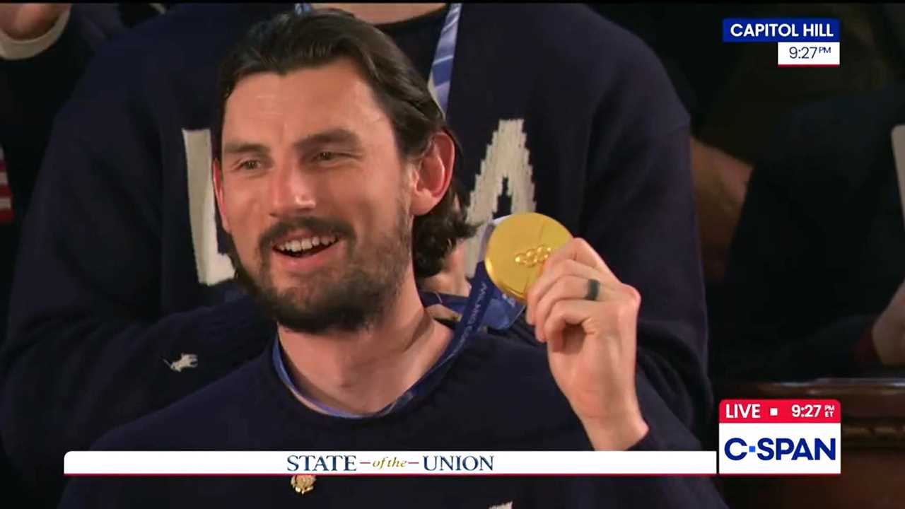 Goalie Connor Hellebuyck hears he will be awarded the Medal of Freedom.