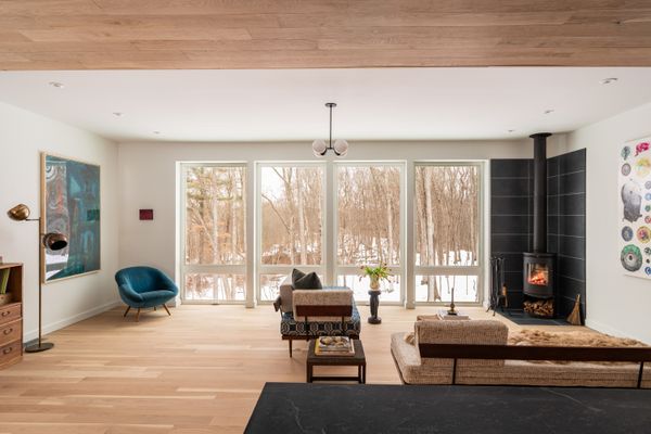 A Norwegian-style Morsø wood stove anchors the living room.