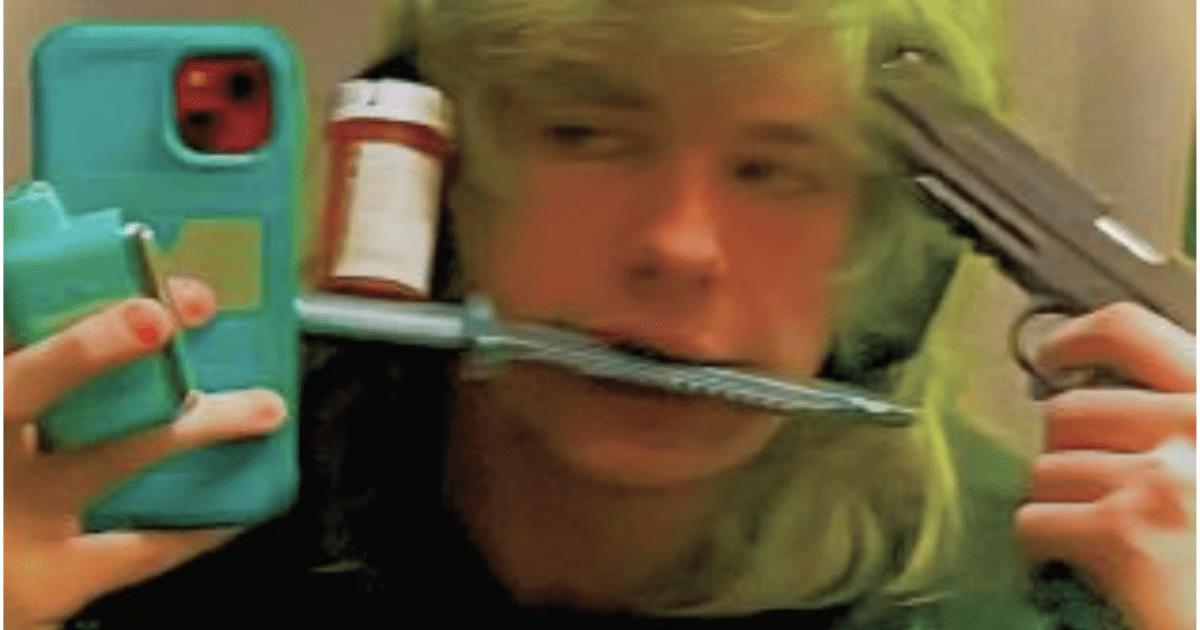 A person with green hair holds a phone, a pill bottle, and a knife, while posing with a handgun in a mirror selfie.