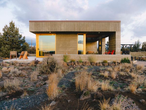 After buying seven acres of land outside Bend, Oregon, Peter and Jan Hackett got to work building their dream retirement house—by hand. With the help of Brooklyn-based architect Brandon Dean, they created a board-formed concrete haven that fits the high desert surroundings as well as their outdoor lifestyle.