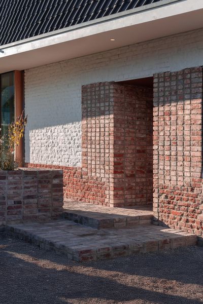 You’d Never Believe This Angular Glass Facade Stands Among Former Military Barracks