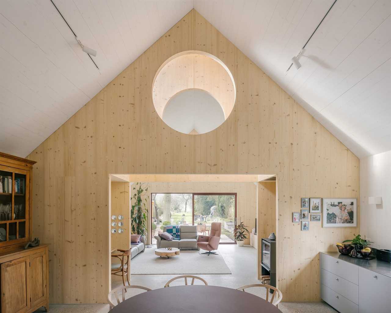 Timber Structures Pull Triple Duty Inside This Belgian Home for a Retired Couple