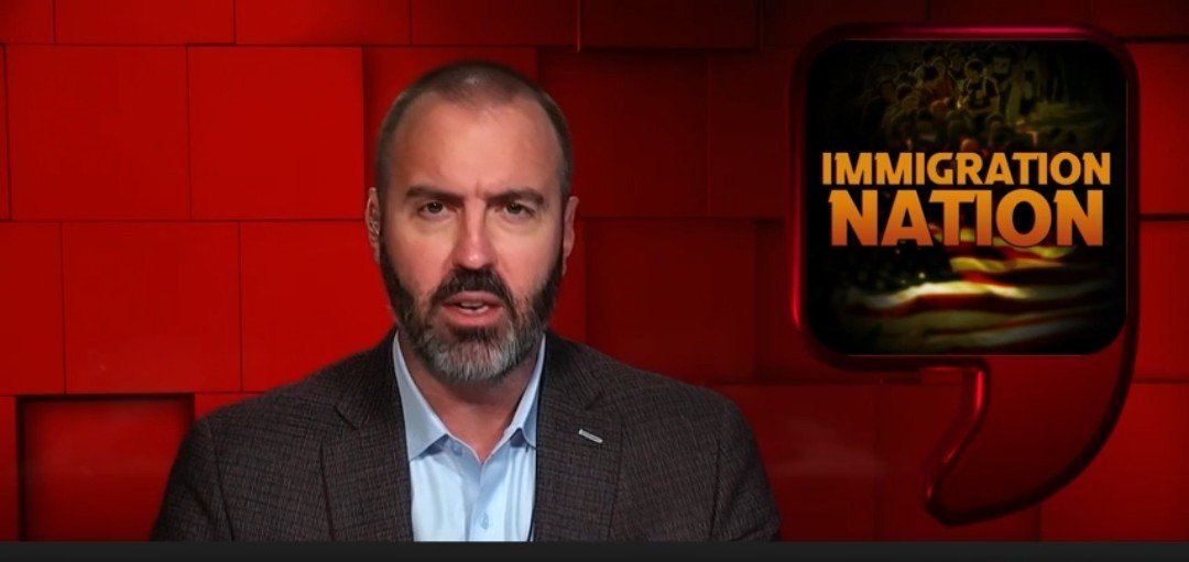 Host discussing immigration issues on a news program, with a graphic displaying the title "Immigration Nation" in the background.