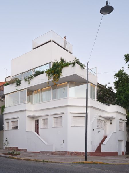 Architects Nicolás Waldman and Agustina Ghiglione converted the vertical space above Agustina’s mother’s office into an airy live/work space where they can run their architecture studio and invite friends over for <i>asado</i> on the terrace.