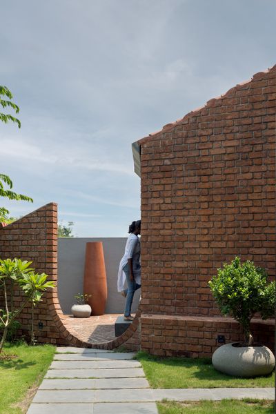 Brick Portals Channel Light and Air in This Multigenerational Home in India