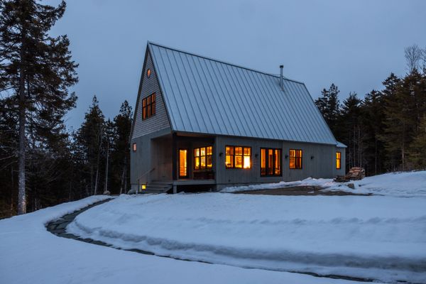 The home's steeply pitched roof, inspired by traditional Japanese farmhouses known as minkas, is useful during Maine's snowy winters.