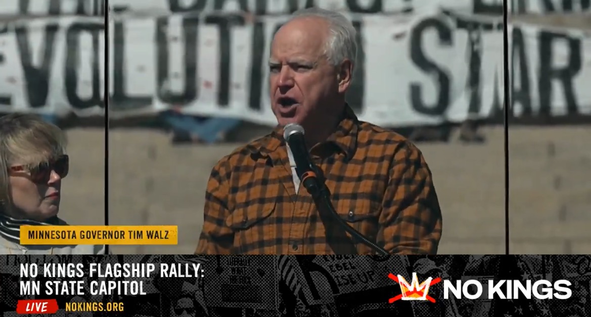Minnesota Governor Tim Walz speaks at the No Kings Flagship Rally at the State Capitol, advocating for social change and community engagement.