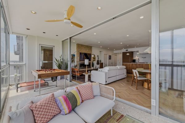 Both the bathrooms and balcony feature terrazzo tile.