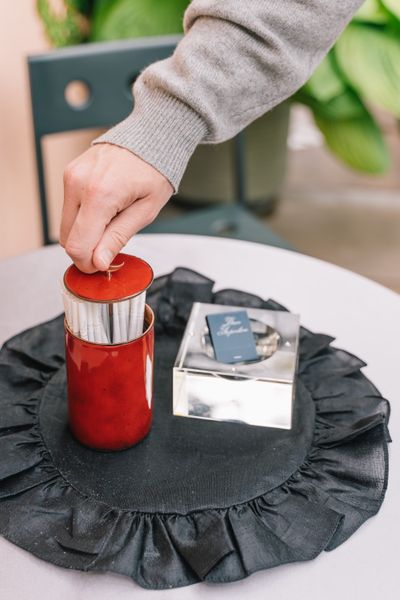 A cigarette box was a highlight of the collection, utilizing a contraption that functions like a straw holder at an old diner.