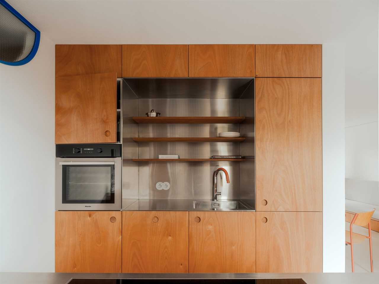 Would You Believe This Prim Amsterdam Apartment Was Once Part of a Sewage Treatment Plant?