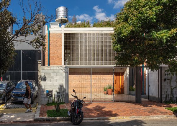 Massive Concrete Screens Bring Plenty of Light and Air to This Sandwiched-In Brazilian Home