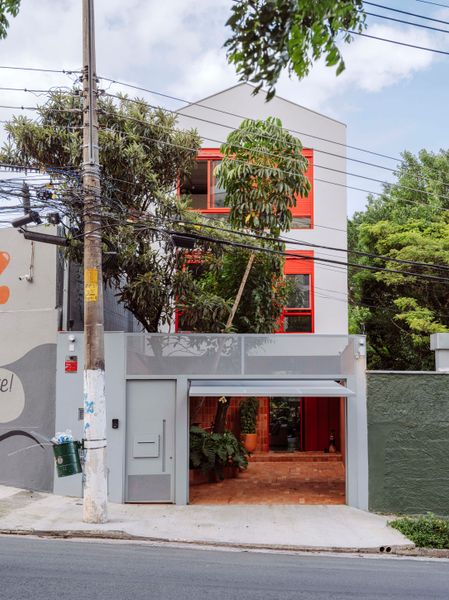 From the street, the house resembles a milk carton.