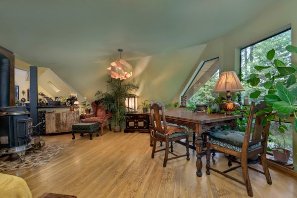 The main living space is partially heated by two separate woodburning stoves.