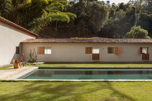 A Monumental Hearth Anchors This Agricultural Building Turned Home in Brazil