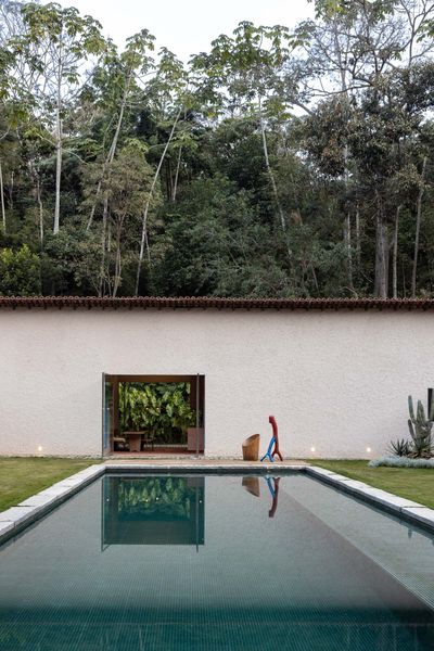 A Monumental Hearth Anchors This Agricultural Building Turned Home in Brazil