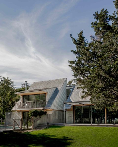 The addition of oversized dormer windows (one of two pictured on the left) increases the volume of usable space, while offering second-floor views of the harbor.