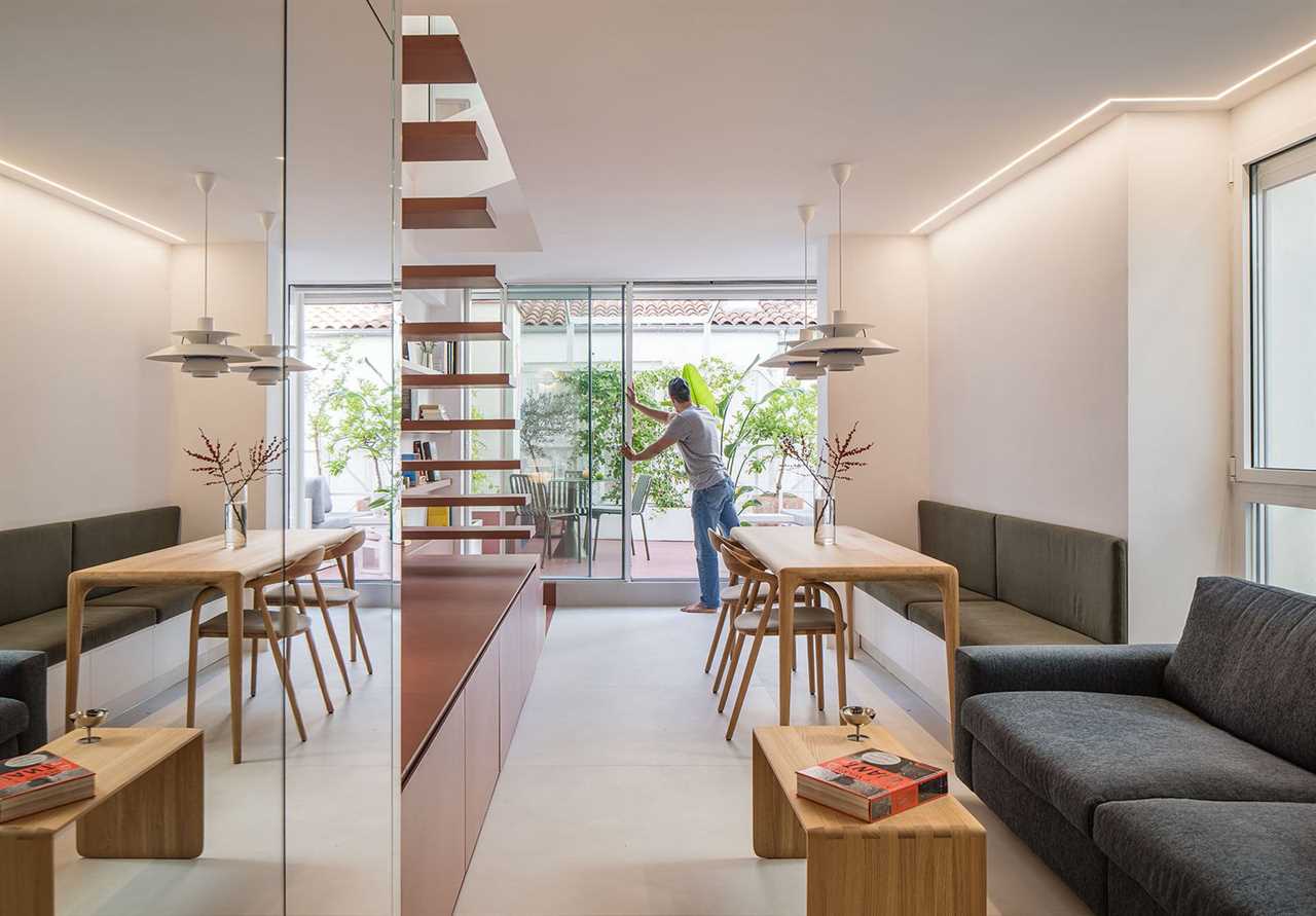 Philippe often hosts family and friends, whether for a weekend or a glass of champagne. The second floor has a guest bedroom, while downstairs a sleeper sofa from Bo Concept and various seating areas make space for all.
