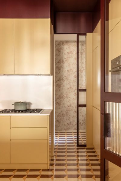 30 Years Later, They Reimagined Their Rome Apartment With a Glassy Central Kitchen