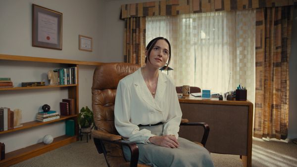 Renate Reinsve plays therapist Dr. Mary Kline, whose office is decorated with plain though period appropriate furnishings.