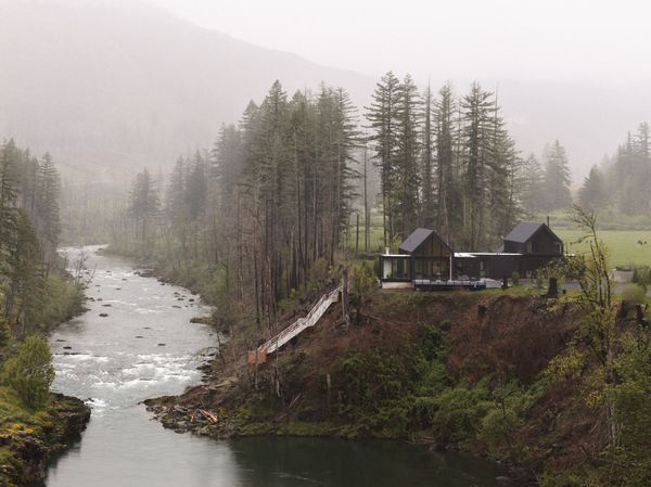 The 3,400-square-foot Line Hole Cabin takes its name from a fishing hole on the Santiam River directly below the property. The home’s dark shou sugi ban cladding and metal roof strengthen the home’s fire resilience and allow it to visually dissolve into the regenerating landscape.