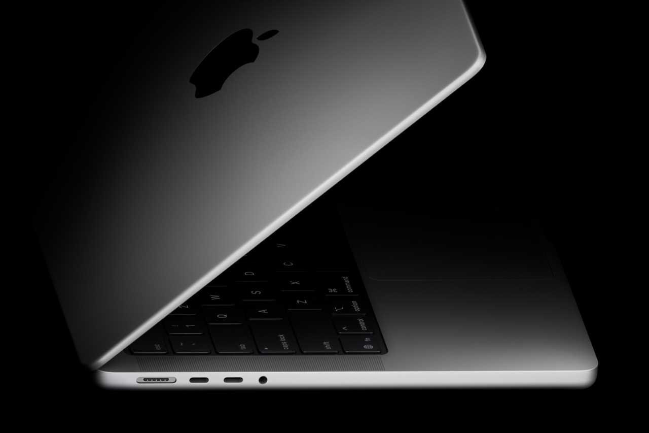 Looking at a MacBook Pro from the side with the lid partially open