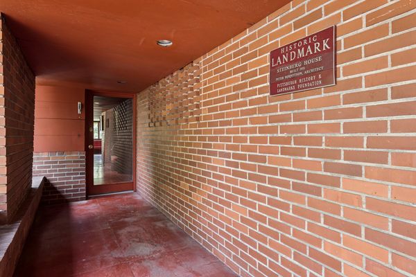 Hope and Terence Alcorn had just sold their Frank Lloyd Wright in Buffalo, New York, when they decided to buy and renovate the home. After restoration was complete, the Pittsburgh History and Landmarks Foundation gave them a plaque.