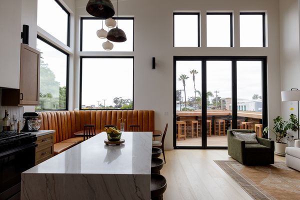The couple splurged and bought La Cantina doors for the opening to the deck, along with the large corner windows from Milgard in the dining area. "Bifold doors are expensive, but they’re worth it when you use them correctly,