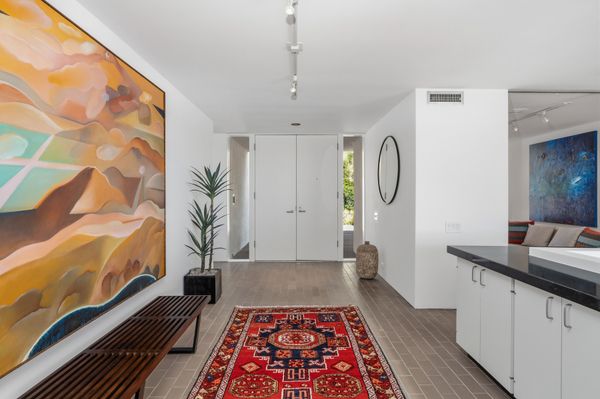 According to the realtor, the interiors bring together four hallmarks of 1970s Modernism: unadorned redwood, expanses of glass, strong linear compositions, and bold geometric forms.