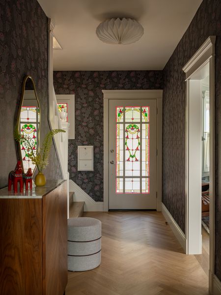 For the wallpaper, Mackenzie chose the Iceflower Brown pattern by Klaus Happenimi, and paired it with an Orikata Flishmount light from Room and Board.