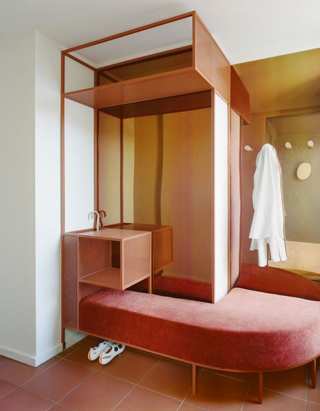 Architect Jane Caught designed this hall stand for the entry way, using coloured steel to echo the copper tones used throughout the house.