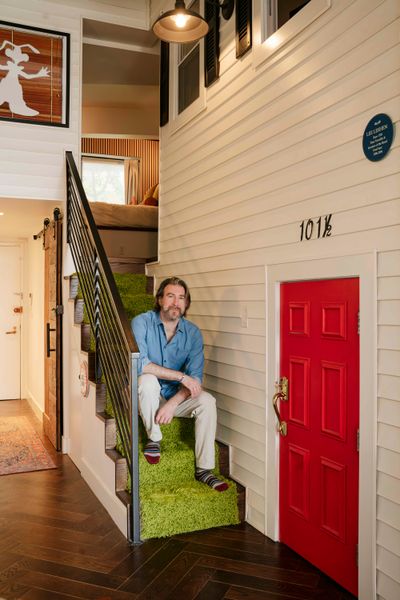 <span style="font-family: Theinhardt, -apple-system, BlinkMacSystemFont, "Segoe UI", Roboto, Oxygen-Sans, Ubuntu, Cantarell, "Helvetica Neue", sans-serif;">Lee sits on the turf-covered stairs of the mini
