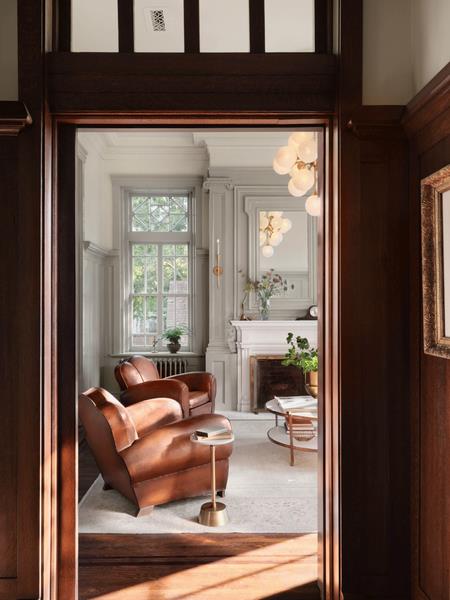 Brighter rooms offer a refreshing contrast to the dark millwork.