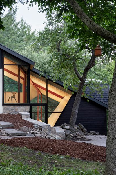 A Massive New Roof Turns a ’70s Chalet in Canada Into a Forest Palace