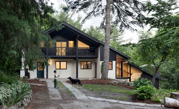 A Massive New Roof Turns a ’70s Chalet in Canada Into a Forest Palace