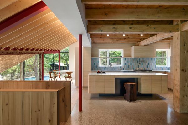 A Massive New Roof Turns a ’70s Chalet in Canada Into a Forest Palace