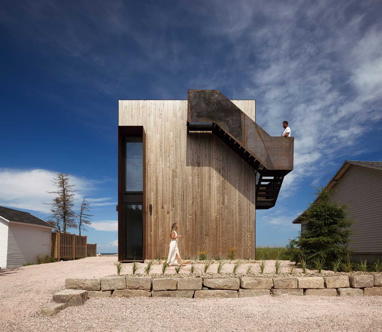 Foul Weather Is No Match for This Boxy New Brunswick Home—or the Steel Stair Wrapped Around It