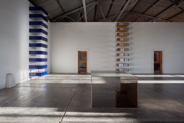 At the Block in Marfa, Texas, Judd used two hangars to display his work. In one of the rooms of the east building, the artist mounted three