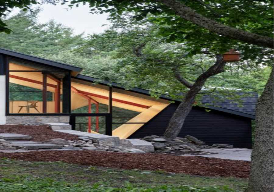 A Massive New Roof Turns a ’70s Chalet in Canada Into a Forest Palace