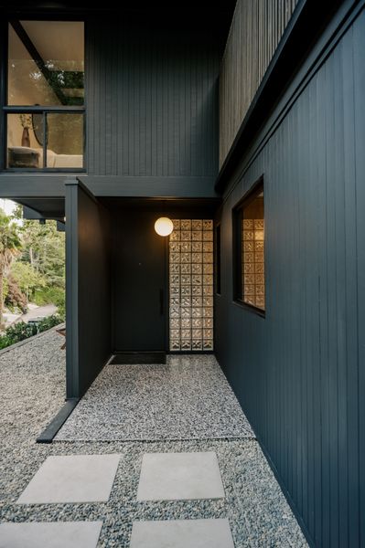 This $2.8M L.A. Midcentury Has an Ink-Black Facade and Bright-White Interiors