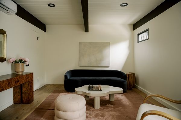 This $2.8M L.A. Midcentury Has an Ink-Black Facade and Bright-White Interiors