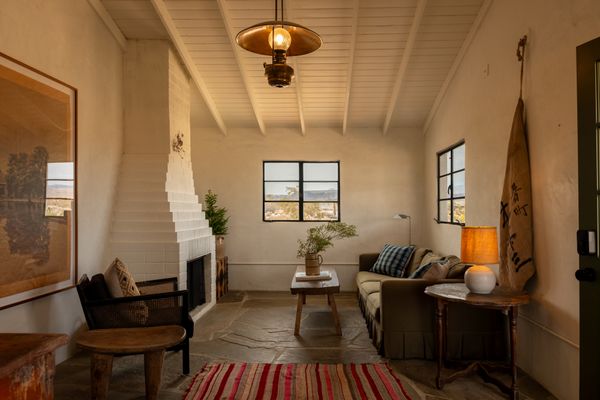 The tiered brick fireplace is original to the home.