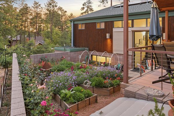 The home is set on a private lot surrounded by mature ponderosa pines.