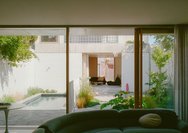 It’s Made From Glass Bricks, But Their Backyard Studio Is Anything But ’80s