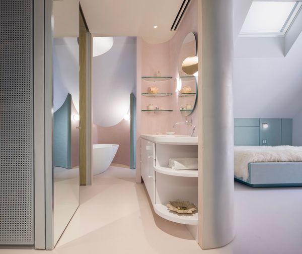 <span style="font-family: Theinhardt, -apple-system, BlinkMacSystemFont, "Segoe UI", Roboto, Oxygen-Sans, Ubuntu, Cantarell, "Helvetica Neue", sans-serif;">The ceiling throughout the primary suite is painted in <a href="https://www.farrow-ball.com/us/paint/blackened">Farrow & Ball’s Blackened</a>, while the area around the vanity and bathtub is waterproof tadelakt finish by Sobro Studios in tone similar to <a href="https://www.farrow-ball.com/us/paint/calamine">Farrow & Ball’s Calamine</a>.</span>