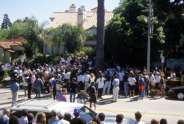 Media gathered outside the condo where Nicole Brown Simpson and Ron Goldman were stabbed to death a day earlier on June 13, 1994 in Brentwood, California.