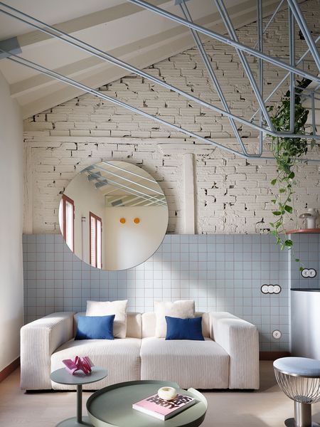 The Loft in This Madrid Flat Hangs From the Ceiling With a Metal Truss