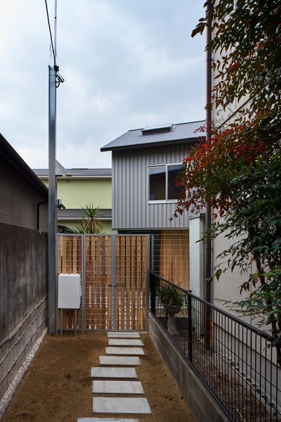 A Ceiling Cutout Above the Dining Area in This Kyoto Home Doubles as a Desk